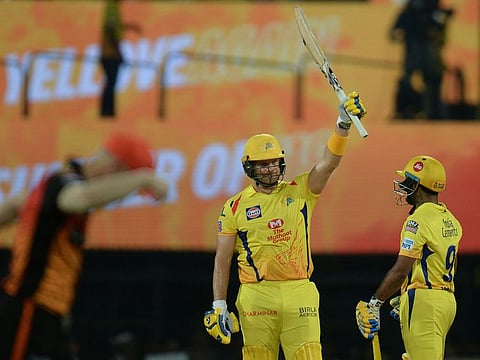 Chennai Super Kings cricketer Shane Watson (C) celebrates reaching his 50.