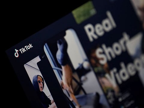 The logo of TikTok application is seen on a screen in this picture illustration.