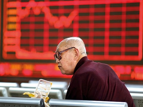 An investor at a brokerage in Beijing. Chinese stocks comprise the biggest share in the $1-billion Templeton EM Fund.