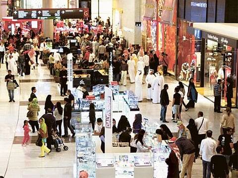 Customers throng the Dubai Mall to check out offers by retail outlets.