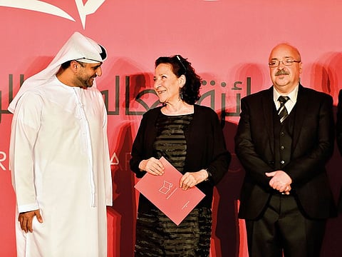Hoda Barakat with (left) Abdullah Majid Al Ali, acting executive director at the National Library at the Department of Culture and Charafdine Majdouline, chair of the 2019 judging panel.