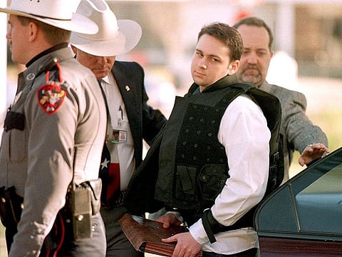 In this file photo taken on February 24, 1999 John William King (C) is escorted into the Jasper County Courthouse for the penalty phase of his capital murder trial in Jasper, Texas.
