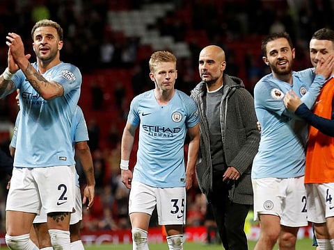 Oleksandr Zinchenko (centre) with Manchester City manager Pep Guardiola (right). Zinchenko is on the verge of moving to Premier League rivals Arsenal. 