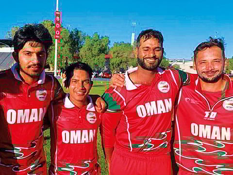 Oman players pose after winning their fourth successive game in the ICC’s WCL Division Two in Windhoek, Namibia.
