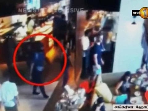 A man with a backpack walks in Shangri La hotel restaurant in Colombo, Sri Lanka, April 21, 2019 in this screen grab taken from a CCTV footage released on April 24, 2019. 