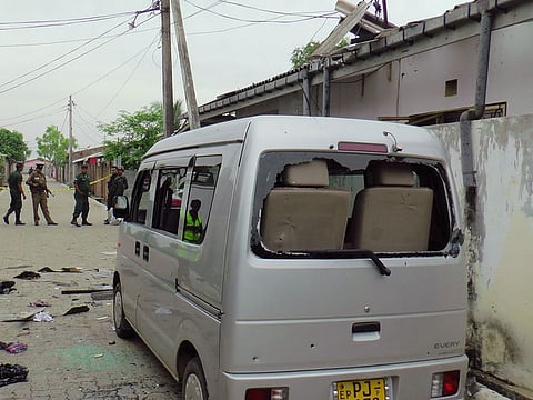 Sri Lankan police and army soldiers secure the site after an explosion and a gunbattle in Kalmunai,  eastern Sri Lanka Saturday, April 27, 2019. 