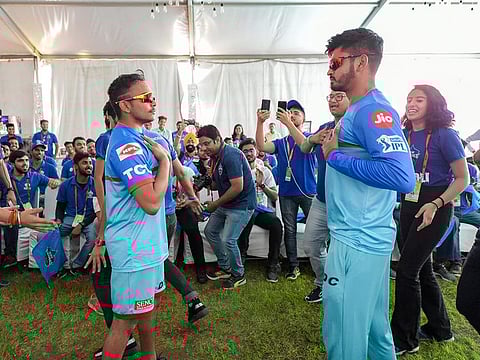 Delhi Capitals captain Shreyas Iyer and teammate Prithvi Shaw dance with fans before the practice session on the eve of their IPL match against Royal Challengers Bangalore (RCB), at Feroz Shah Kotla Stadium in New Delhi, Saturday, April 27, 2019. 