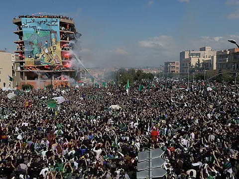 Demonstrators light flares during a protest in Bordj Bou Arreridj, east of Algiers, on Friday, April 26, 2019. 