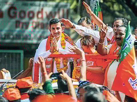 Former cricketer and BJP candidate from East Delhi Gautam Gambhir greets his supporters during an election roadshow for Lok Sabha elections, in New Delhi, Saturday, April 27, 2019. 