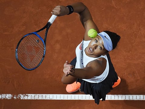 Japan's Naomi Osaka serves to Croatia's Donna Vekic during their Porsche tennis Grand Prix match in Stuttgart, Germany, on Friday. 