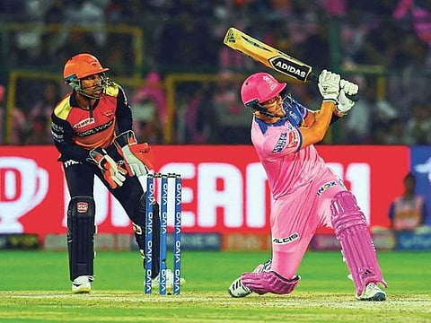 Rajasthan Royals batsman Liam Livingstone (R) plays a shot as Sunrisers Hyderabad wicket keeper Wriddhiman Saha (L) looks on during the 2019 Indian Premier League (IPL) Twenty20 cricket match between Rajasthan Royals and Sunrisers Hyderabad at the Sawai Mansingh Stadium in Jaipur on April 27, 2019.