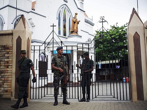 Soldiers stand guard a closed church in Colombo on April 28, 2019, a week after a series of bomb blasts targeting churches and luxury hotels on Easter Sunday in Sri Lanka. Sri Lanka's Roman Catholic leader condemned the Easter attacks as "an insult to humanity" as the country marked a week since suicide bombers hit three churches and three luxury hotels. 