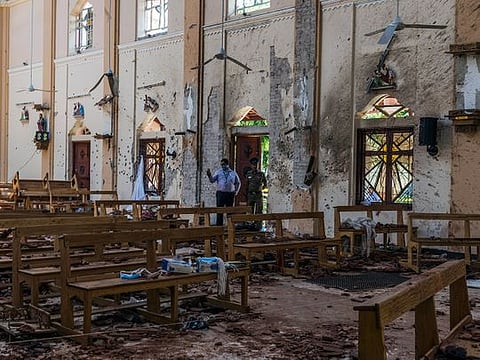 Investigators in Negombo, Sri Lanka, on Monday, April 22, 2019, at the scene of a suicide bombing at St. Sebastian Church. 