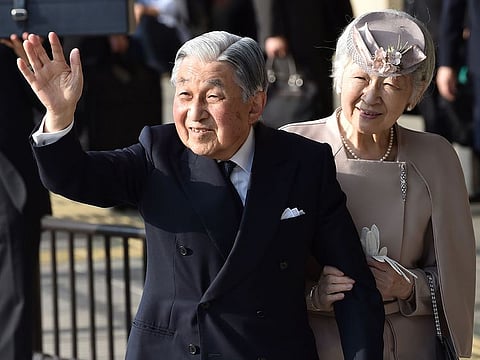 Japan's Emperor Akihito, accompanied by Empress Michiko, waves to well-wishers before leaving Ujiyamada Station after their visit to Ise Jingu shrine in Ise in the central Japanese prefecture of Mie, April 18, 2019, as he takes part in a series of rituals ahead of his abdication.  