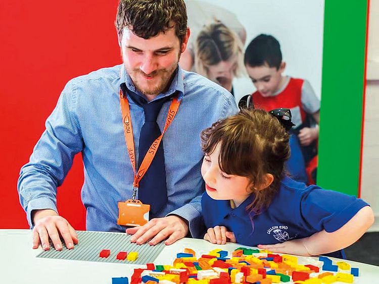 Children playing with Lego bricks