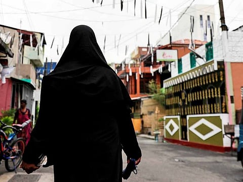 A Muslim woman walks through a street near St Anthony's Shrine, days after a string of suicide bomb attacks across the island on Easter Sunday, in Colombo, Sri Lanka, April 29, 2019. 