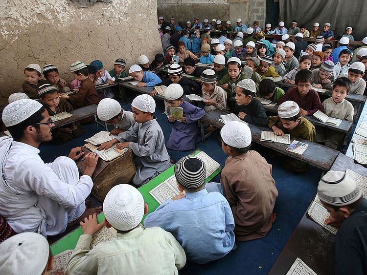 Students attend a religious madrasa