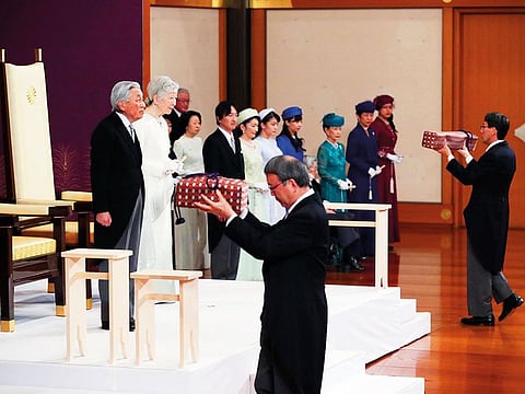 Japan’s emperor Akihito and empress Michiko attend a ritual for the emperor’s abdication, carrying two of the socalled Three Sacred Treasures of Japan, at the Imperial Palace in Tokyo on Tuesday. 