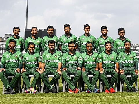 In this photo taken on April 29, 2019 Bangladesh cricket team members pose for photograph as they wear the team's official jersey at the Sher-e-Bangla National Cricket Stadium in Dhaka, ahead of the ICC World Cup in England. 