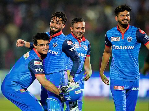 Delhi Capitals team mentor Sourav Ganguly (left) picks up Rishabh Pant (right) as they celebrate after  winning the IPL match against  Rajasthan Royals at the Sawai Mansingh Stadium in Jaipur on April 22, 2019.   