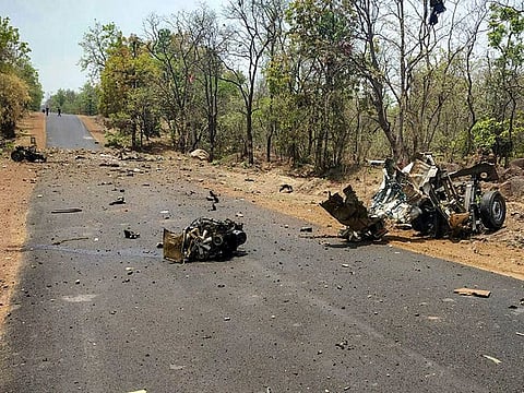 Mangled remains of a police vehicle, carrying security personnel that was allegedly blasted by Maoists using IED, in Gadchiroli, Wednesday, May 1, 2019.  