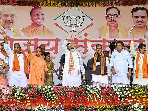 Prime Minister Narendra Modi with Uttar Pradesh Chief Minister Yogi Adityanath, BJP Lok Sabha candidates and other leaders wave at supporters during an election rally for Lok Sabha polls, in Ayodhya, onWednesday, May 1, 2019. 