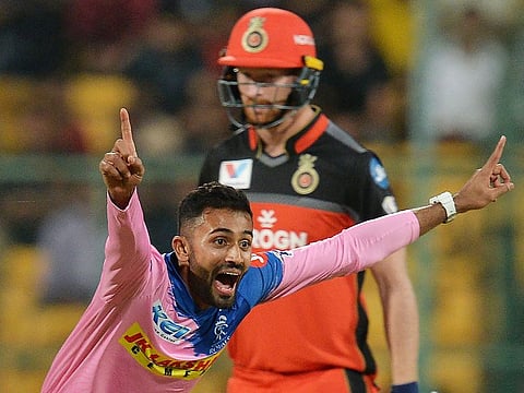 Rajasthan Royals' Shreyas Gopal celebrates the hat-trick dismissal of Royal Challengers Bangalore batsman Marcus Stoinis during the IPL match between them at The M. Chinnaswamy Stadium in Bangalore on April 30, 2019. 
