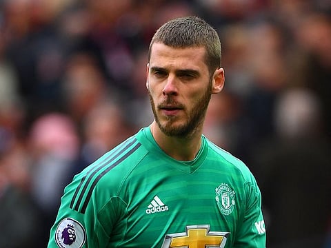 Manchester United's Spanish goalkeeper David de Gea leaves the pitch at half-time.