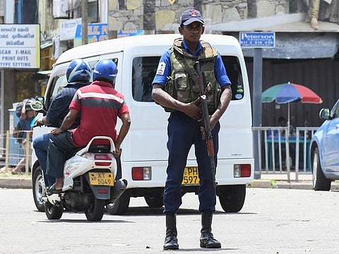 A Sri Lankan soldier stands guard at a checkpoint in Colombo on May 4, 2019, after a series of bomb blasts targeting churches and luxury hotels on Easter Sunday in Sri Lanka. 