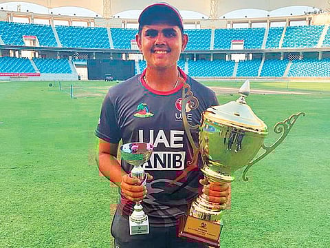 Aryan Lakra with the ACC Western Region U-19 Cup and Player of the Tournament trophy.