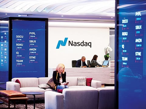 Stock market information is displayed at Nasdaq’s MarketSite centre in New York. The Nasdaq 100 ended the week 0.2 per cent higher, capping it with a Friday flourish of 1.6 per cent.
