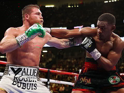 Canelo Alvarez (left) and Daniel Jacobs battle during their middleweight unification fight at T-Mobile Arena on May 04, 2019 in Las Vegas, Nevada.   