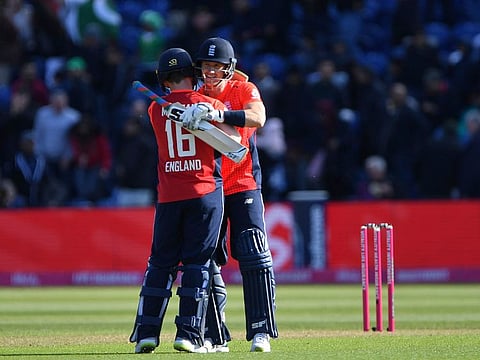 England's Eoin Morgan and Joe Denly celebrate their win against Pakistan.