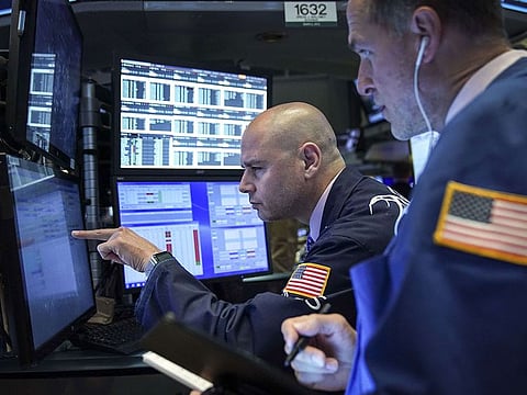 Traders and financial professionals work at the opening bell on the floor of the New York Stock Exchange (NYSE), May 6, 2019 in New York City.
