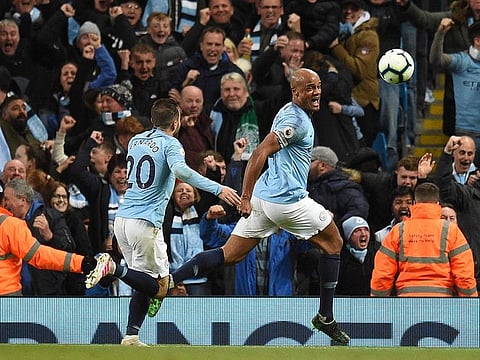 Vincent Kompany celebrates his crucial strike.