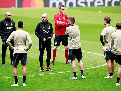 Ajax coach Erik ten Hag with Klaas-Jan Huntelaar and their players during training.