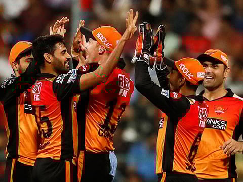 Sunrisers Hyderabad's Bhuvneshwar Kumar, second left, celebrates with teammates the dismissal of Royal Challengers Bangalore's AB de Villiers during the IPL match between them in Bangalore, on Saturday, May 4, 2019. 