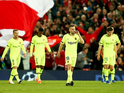 Barcelona players leave the field after losing the Champions League semifinal, second leg, match against Liverpool at the Anfield stadium in Liverpool. 