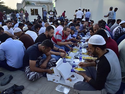 People break their fast at Al Farooq Omar Bin Al Khattab Mosque (Blue Mosque) in Dubai during Iftar on 7th May, 2019. 