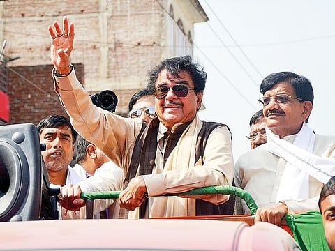 Bollywood actor and Congress candidate from Patna Sahib Shatrughan Sinha and state party president Madan Jha during an election campaign roadshow for the Lok Sabha polls, in Patna, Wednesday, May 8, 2019.