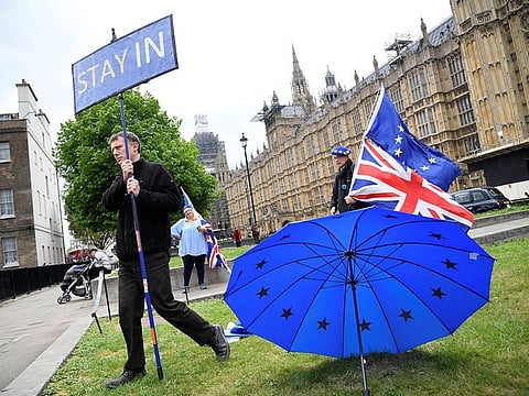 Anti-Brexit protesters are seen near the Houses of Parliament in London, Britain.
