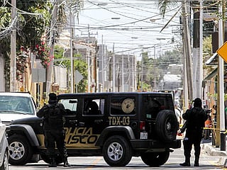 Mexican police members. Authorities said the two 18-year-old alleged attackers armed with knives and fireworks killed a female assistant principal and injured three other people in an attack at a school in northern Mexico.
