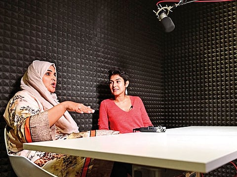 Rana Nawas (right), the producer of the English-language series 'When Women Win', hosts Saudi Arabian comedian Hatoon Kadi during a podcast recording session in Dubai on April 25, 2019. 