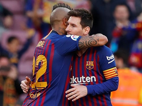Barcelona's Arturo Vidal celebrates scoring their first goal with Lionel Messi.
