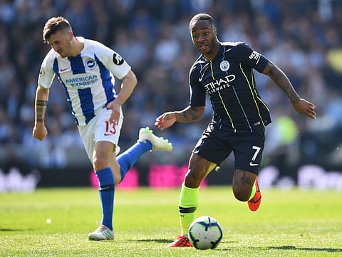Manchester City's English midfielder Raheem Sterling (R) is chased by Brighton's German midfielder Pascal Gross (L) during the English Premier League football match between Brighton and Hove Albion and Manchester City at the American Express Community Stadium in Brighton, southern England on May 12, 2019.