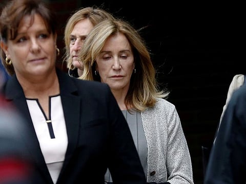 Actress Felicity Huffman leaves the federal courthouse after facing charges in a nationwide college admissions cheating scheme in Boston, Massachusetts, U.S., May 13, 2019.