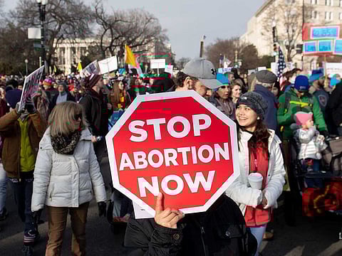 Anti-abortion activists participate in the "March for Life" an annual event to mark the anniversary of the 1973 Supreme Court case Roe v. Wade outside the US Supreme Court in Washington, DC.