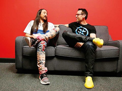 Steve Aoki and Tom Bilyeu sit for a portrait during a signing of his new comic book series ‘Neon Future’.