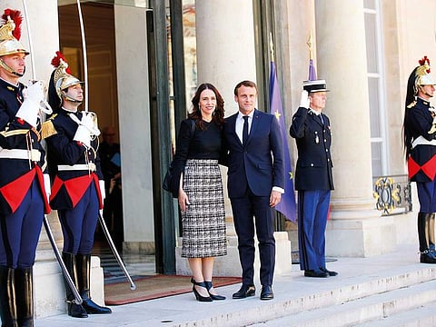 New Zealand Prime Minister Jacinda Ardern, center left, is greeted by French President Emmanuel Macron, center right, as she arrives at the Elysee Palace, in Paris, Wednesday, May 15, 2019.
