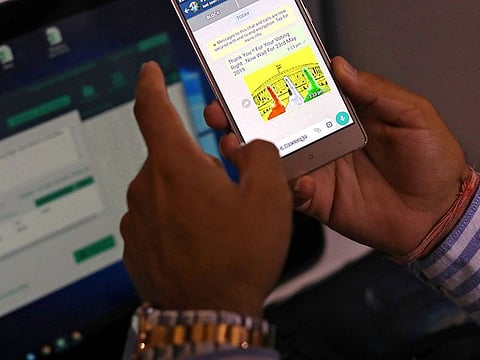 Rohitash Repswal, a digital marketer, checks a WhatsApp message that he sent using a software tool that appears to automate the process of sending messages to WhatsApp users, inside his office in New Delhi.